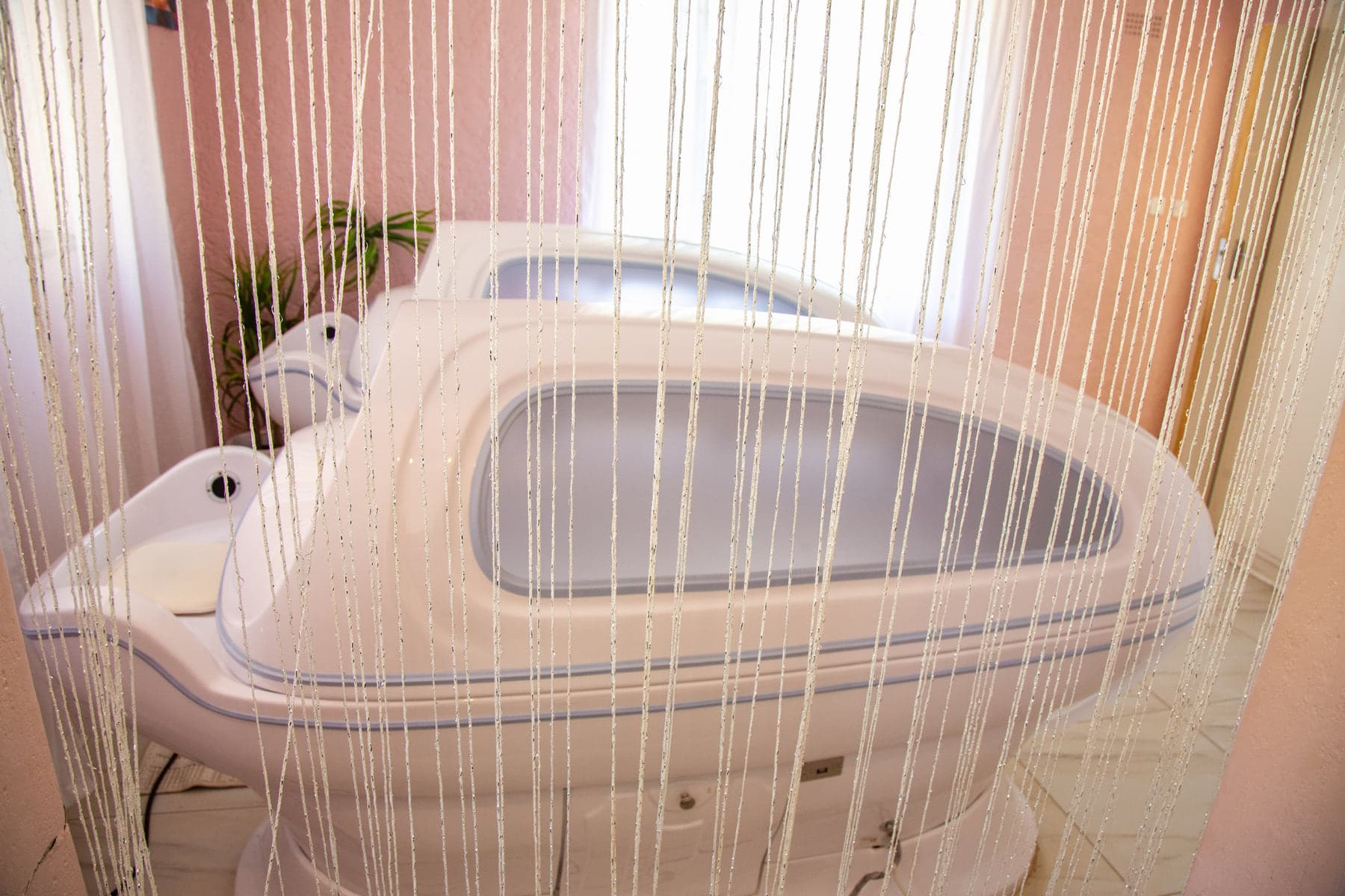 Twin hydrotherapy spa capsules in a private treatment room at Lewa Health Spa